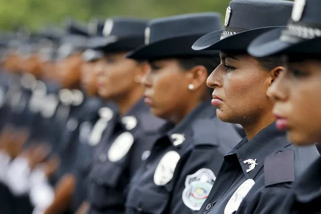 Female graduates from the National Police stand in formation during their graduation ceremony in Panama City June 29, 2015. As part of the government's strategy to fight violence and crime, more then 600 policemen graduated in Panama this year, according to local media. (Photo by Carlos Jasso/Reuters)