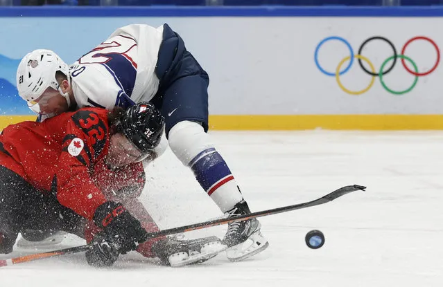 Mason Mctavish of Canada in action with Brian O'neill of the United States at National Indoor Stadium in Beijing, China on February 12, 2022. (Photo by David W. Cerny/Reuters)