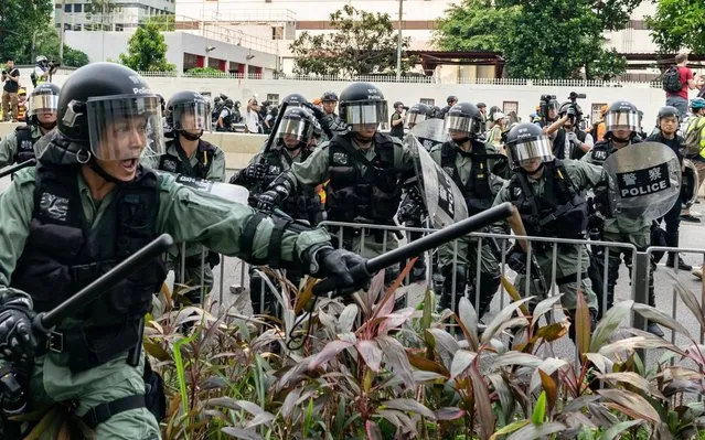 Riot police charge toward protesters during a clearing at an anti-government rally in Kowloon Bay district on August 24, 2019 in Hong Kong, China. (Photo by Anthony Kwan/Getty Images)