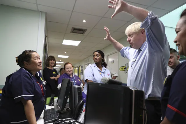 Prime Minister Boris Johnson meets members of staff during a visit to Whipps Cross University Hospital in Leytonstone on September 18, 2019 in London, England. (Photo by Yui Mok – WPA Pool/Getty Images)
