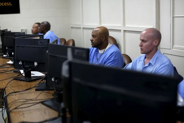 Prisoners work at computers following a graduation ceremony from a computer coding program at San Quentin State Prison in San Quentin, California April 20, 2015. (Photo by Robert Galbraith/Reuters)