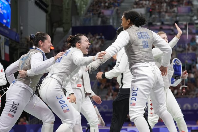 United States' Lee Kiefer, Lauren Scruggs, Jaqueline Dubrovich and Maia mei Weintraub celebrate after winning the women's team foil semifinal match against Canada during the 2024 Summer Olympics at the Grand Palais, Thursday, August 1, 2024, in Paris, France. (Photo by Rebecca Blackwell/AP Photo)