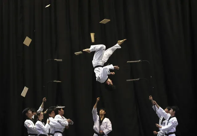 Members of the South Korean Taekwondo demonstration team perform during a visit by Bulgarian Prime Minister Boyko Borisov at Kukkiwon, the headquarters and academy of World Taekwondo, in Seoul, South Korea, Wednesday, September 25, 2019. Borisov arrived on Wednesday for a three-day to meet South Korean President Moon Jae-in to discuss economic ties and boost bilateral cooperation. (Photo by Ahn Young-joon/AP Photo)