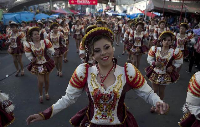 Dancers perform the “Caporales” during the annual parade in honor of “El Senor del Gran Poder” in La Paz, Bolivia, Saturday, June 10, 2017. (Photo by Juan Karita/AP Photo)