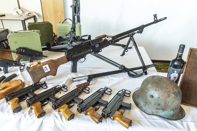 This picture provided by the Austrian Interior Ministry on Thursday, June 29, 2023 shows secured weapons, objects and ammunitions. Austrian authorities have seized large amounts of drugs and weapons in a raid on a far-right biker gang tied to organized crime. Public broadcaster ORF reported Thursday that police searched properties in Upper Austria and detained 10 people on suspicion of breaching firearms, narcotics and extremism laws. (Photo by BMI/Gerd Pachauer via AP Photo)