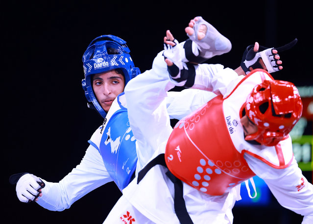 Nasser Al Dhuwayyan of Team AlUla (L)competes against Abdullah Almushraf of Team Al Shabab in the Youth Men's Taekwondo -48kg Round of 16 Bout on day twelve of the Saudi Games 2024 on October 14, 2024 in Riyadh, Saudi Arabia. The Saudi Games is a multi-game combined sports tournament and the largest national sporting event held annually in the Kingdom. (Photo by Hector Vivas/Getty Images for Saudi Games)