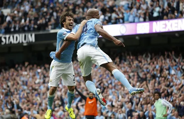 Football, Manchester City vs Chelsea, Barclays Premier League, Etihad Stadium on August 16, 2015: Vincent Kompany celebrates with David Silva after scoring the second goal for Manchester City. (Photo by Andrew Yates/Reuters/Livepic)