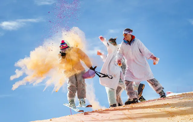 Skiers take part in the Skicolor event where they are sprayed with biodegradable color powders as part of carnival celebrations in the alp​ine resort of La Tzoumaz, Switzerland, 23 February 2020. (Photo by Valentin Flauraud/EPA/EFE)
