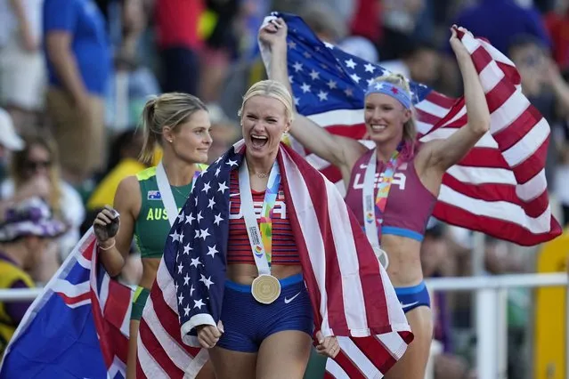 Gold medalist Katie Nageotte, of the United States, walks with silver medalist Sandi Morris, of the United States, right, and Nina Kennedy, of Australia, after the women's pole vault final at the World Athletics Championships on Sunday, July 17, 2022, in Eugene, Ore. (Photo by Ashley Landis/AP Photo)