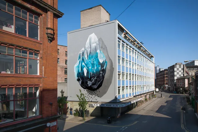 “Inhuman barriers” mural painting that addresses the theme of immigration realized for “Cities of hope” in Manchester, U.K., in support to the local solidarity group WASP (Women Asylum Seekers Together), 2016. (Photo by NeverCrew/The Huffington Post)