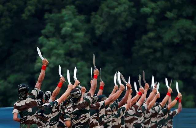 Indian Army soldiers display their martial skills during a two-day “Know Your Army” exhibition in Ahmedabad, India, August 19, 2016. (Photo by Amit Dave/Reuters)