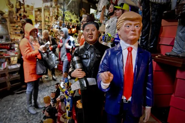Statuettes of U.S. President Donald Trump and North Korean leader Kim Jong Un, holding a missile, are shown in a shop in Naples, Italy, Thursday, December 14, 2017. Naples' Christmas artisans are at it again, turning figures from current events into ceramic characters to decorate miniature Nativity scenes that take over Italian living rooms this time of year. (Photo by Ciro Fusco/ANSA via AP Photo)