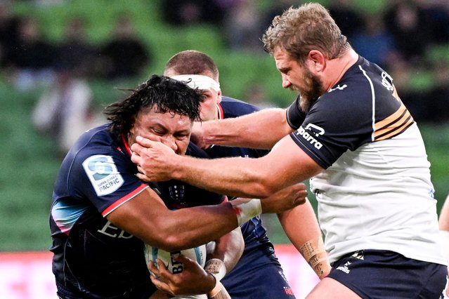 Rebels' Rob Leota (L) is tackled by Brumbies' James Slipper (R) during during the Super Rugby match between the Melbourne Rebels and the ACT Brumbies in Melbourne on February 23, 2024. (Photo by William West/AFP Photo)