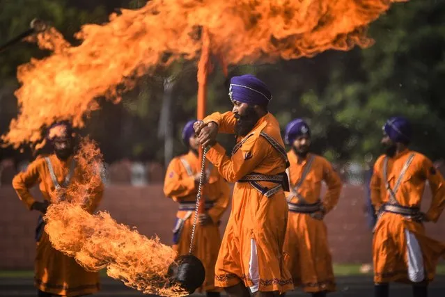 Members of the Sikh Regimental Center display their Gatka martial skills during a combined display ahead of the graduation ceremony, at the Officers Training Academy (OTA) in Chennai, India, 28 October 2022. A combined display of training proficiency was organized at the OTA as a prelude to a passing out parade of cadets. The combined display marks the culmination of the adventure training and showcases the skills and expertise of armed forces display teams. (Photo by Idrees Mohammed/EPA/EFE/Rex Features/Shutterstock)