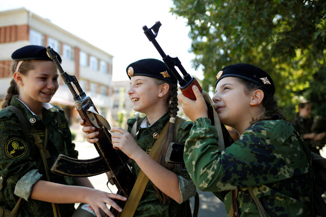 Fifth-grade students of the General Yermolov Cadet School get prepared before their first military tactical exercise on the ground, which includes radiation resistance classes, forest survival studies and other activities, in Stavropol, Russia, September 10, 2016. Picture taken September 10, 2016. (Photo by Eduard Korniyenko/Reuters)