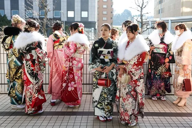 Women wearing kimonos are seen outside of Yokohama Arena on January 09, 2023 in Yokohama, Japan. For about 140 years, the age of adulthood in Japan was 20 years-old, but in April 2022, it was lowered to 18. Some activities, such as smoking and drinking are still not permitted for people under the age of 20. Many cities continue to have ceremonies for citizens turning 20. However, they are changing the name of the ceremony to “20 years-old gathering”. (Photo by Takashi Aoyama/Getty Images)