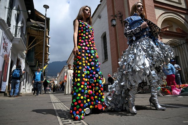 Models present creations made with recycled material and usable waste during the “El Centro Vive Sostenible” fashion and sustainability event in Bogota on March 14, 2024. (Photo by Raul Arboleda/AFP Photo)