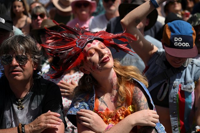 A woman wears a headpiece in the crowd as Brandi Carlile performs at Glastonbury Festival at Worthy Farm in Pilton, Somerset, Britain, on June 29, 2025. (Photo by Jaimi Joy/Reuters)
