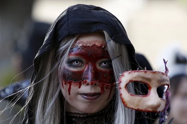 A participant in costume poses for a picture during a Halloween parade in Kawasaki, south of Tokyo, October 25, 2015. (Photo by Yuya Shino/Reuters)