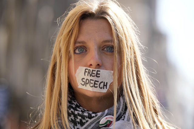 A protester stands outside the High Court in London, Monday, May 20, 2024. WikiLeaks founder Julian Assange faces a hearing Monday in the High Court in London that could end with him being sent to the U.S. to face espionage charges, or provide him another chance to appeal his extradition. The outcome will depend on how much weight judges give to assurances U.S. officials have provided that Assange's rights won't be trampled if he goes on trial. (Photo by Kin Cheung/AP Photo)