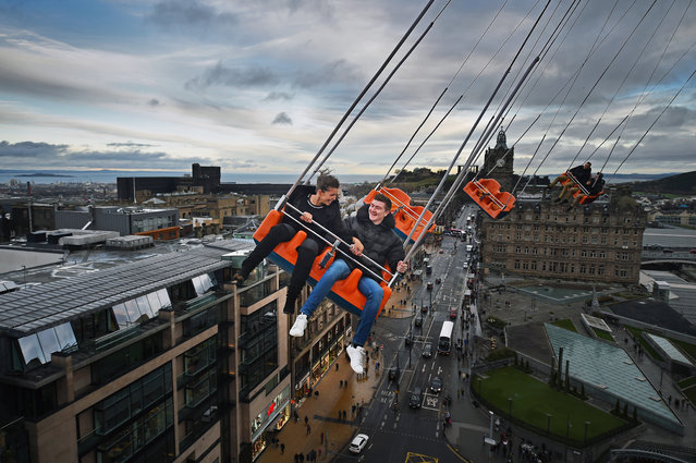 Andrew Foxworthy and his girlfriend Francesca Moscardini take a ride on the star flyer on December 18, 2014 in Edinburgh, Scotland. The star flyer is one of a number of rides situated in Princes Street Gardens in Edinburgh along with a ice rink carousel and Big Wheel, open from late November and running until January 4, 2015. (Photo by Jeff J. Mitchell/Getty Images)