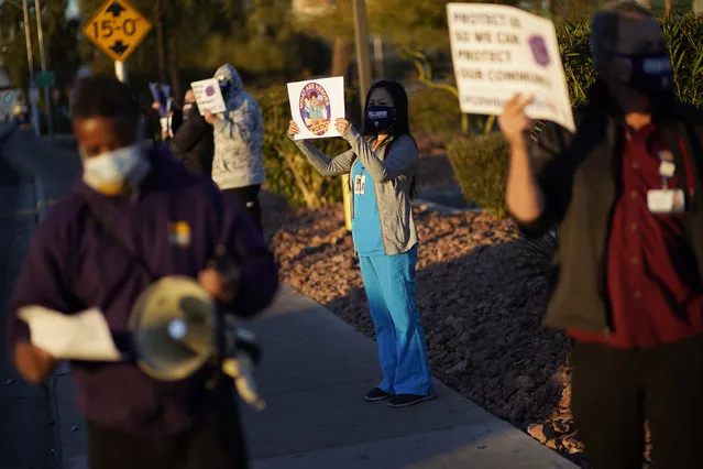 Healthcare workers protest coronavirus pandemic working conditions at Sunrise hospital Wednesday, December 2, 2020, in Las Vegas. (Photo by John Locher/AP Photo)