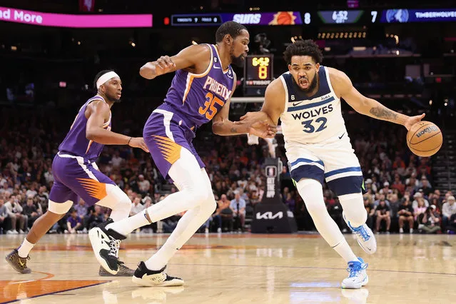 Karl-Anthony Towns #32 of the Minnesota Timberwolves handles the ball against Kevin Durant #35 of the Phoenix Suns during the first half of the NBA game at Footprint Center on March 29, 2023 in Phoenix, Arizona. (Photo by Christian Petersen/Getty Images)