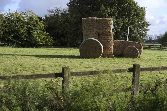 A stack of hay bales shaped as a tractor is seen in a field near Downham Market in Norfolk, in eastern England, October 20, 2016. (Photo by Toby Melville/Reuters)