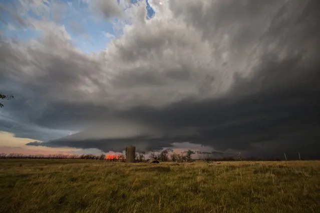A thunderstorm rolls over farmland, on October 1, 2014, in Kansas. (Photo by Roger Hill/Barcroft Media)