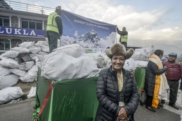 Nepali airline staff prepare to load waste collected from the Everest region at Lukla Airport, the gateway of Mt. Everest, in Lukla, Nepal, 17 March 2018. A clean-up campaign has begun at Mount Everest, aiming to airlift 100 tonnes of rubbish left behind by tourists and climbers of the world's highest mountain. (Photo by Bikas Karki/EPA/EFE)