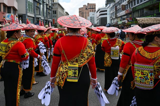 Indigenous Orang Ulu women take part in a procession during the Gawai Dayak Culture Parade in Kuching, capital of the Malaysian state of Sarawak on the island of Borneo, on June 21, 2025. (Photo by Mohd Rasfan/AFP Photo)