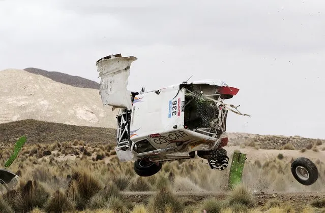 Juan Manuel Silva and Pablo Sisterna (not pictured) of Argentina crash in their Mercedes car during the 7th stage of the Dakar Rally from Iquique to Uyuni, January 10, 2015. (Photo by Daniel Rodrigo/Reuters)