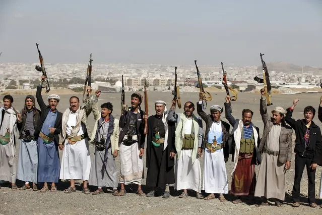Tribesmen loyal to the Houthi movement shout slogans and raise their weapons during a gathering to show their support for the group, in Yemen's capital Sanaa December 14, 2015. (Photo by Khaled Abdullah/Reuters)