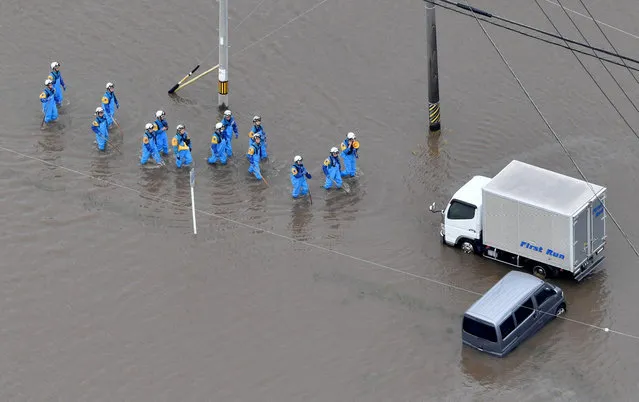 Rescue operations are underway as vehicles are left in floodwaters following heavy rain brought about by Typhoon Mawar, in this photo taken from a Kyodo News helicopter, in Toyokawa, Aichi Prefecture, central Japan in this photo taken by Kyodo on June 3, 2023. (Photo by Kyodo News via Reuters)