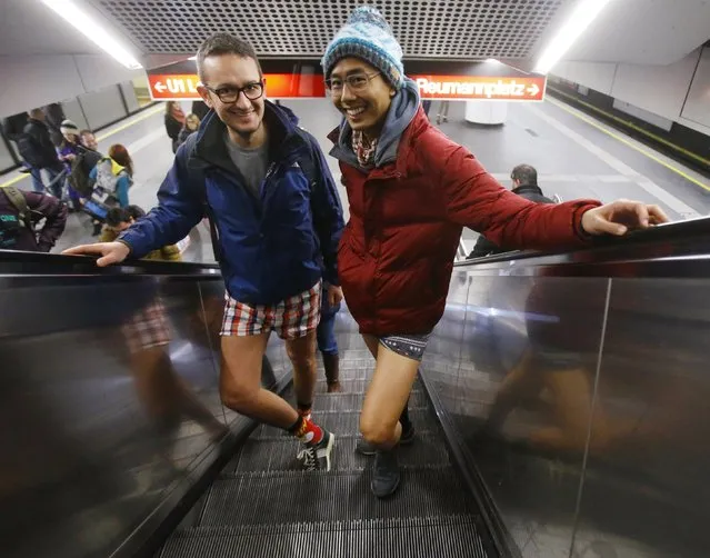 People take part in the 'No Pants Subway Ride' in Vienna, Austria, January 10, 2016. The 'No Pants Subway Ride' is an annual event that has become a global celebration of bare thighs. (Photo by Heinz-Peter Bader/Reuters)