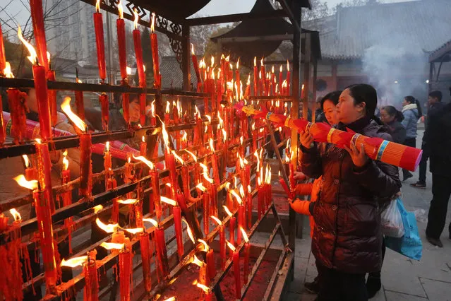 Citizens incense to pray during Laba Festival at Ciyun Temple on January 17, 2016 in Huai'an, Jiangsu Province of China. Thousands of citizens incense to pray and make wishes at Ciyun Temple on Laba Festival, a traditional Chinese holiday, on the eighth day of the twelfth month in the Chinese calendar. (Photo by ChinaFotoPress/ChinaFotoPress via Getty Images)