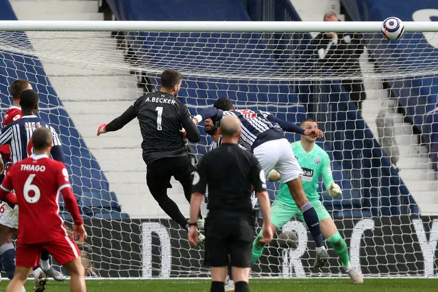 Goalkeeper Alisson Becker of Liverpool scores a goal to make it 1–2 during the Premier League match between West Bromwich Albion and Liverpool at The Hawthorns on May 16, 2021 in West Bromwich, United Kingdom. (Photo by Adam Fradgley – AMA/West Bromwich Albion FC via Getty Images)