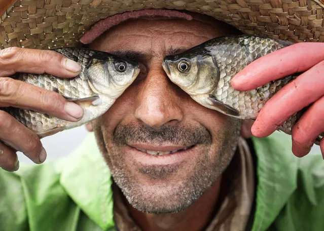 46-year-old Ibrahim Erdogan, who has been fishing for 25 years, poses for a photo with thefishes he caught on a boat at Lake Beysehir in Konya, Turkiye on September 09, 2023. Erdogan, who is fishing in Beysehir Lake, one of Turkiye's most important freshwater fish production centers, collects the nets in the water in the early hours of the morning. (Photo by Esra Hacioglu Karakaya/Anadolu Agency via Getty Images)
