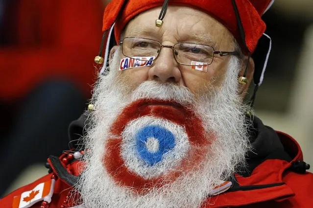 A Canada supporter watches the World Women's Curling Championships in Sapporo March 16, 2015. (Photo by Thomas Peter/Reuters)