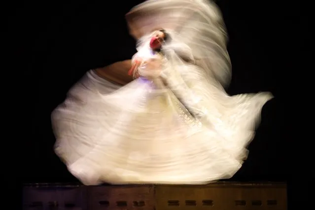 A photo taken using a slow shutter speed shows the rehearsals of the folkloric ballet of Amalia Hernandez at the Palacio de Bellas Artes in Mexico City, Mexico, 14 June 2021. The event will take place following a year without live performances due to coronavirus pandemic restrictions. (Photo by Sashenka Gutierrez/EPA/EFE)
