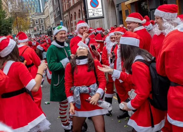 People take part in the SantaCon 2018 on December 8, 2018 in London, England. (Photo by Peter Dench/Getty Images)