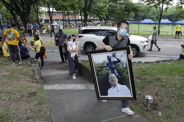 A picture of former Philippine President Benigno Aquino III is carried on Friday, June 25, 2021 at the Ateneo Church of Gesu, Quezon city, Philippines. (Photo by Aaron Favila/AP Photo)