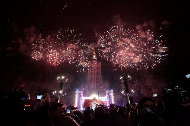 Fireworks explode next to the Palace of Culture during New Year celebrations in Warsaw, Poland January 1, 2017. (Photo by Dawid Zuchowicz/Reuters/Agencja Gazeta)
