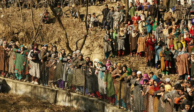 Kashmiri villagers attend the funeral of rebel commander Zeenatul Islam during his funeral procession in Sugan village 61 kilometers (38 miles) south of Srinagar, Indian controlled Kashmir, Sunday, January 13, 2019. Massive anti-India protests and clashes erupted in disputed Kashmir on Sunday, leading to injuries to at least 16 people after a gunbattle between militants and government forces overnight killed two rebels, police and residents said. (Photo by Mukhtar Khan/AP Photo)