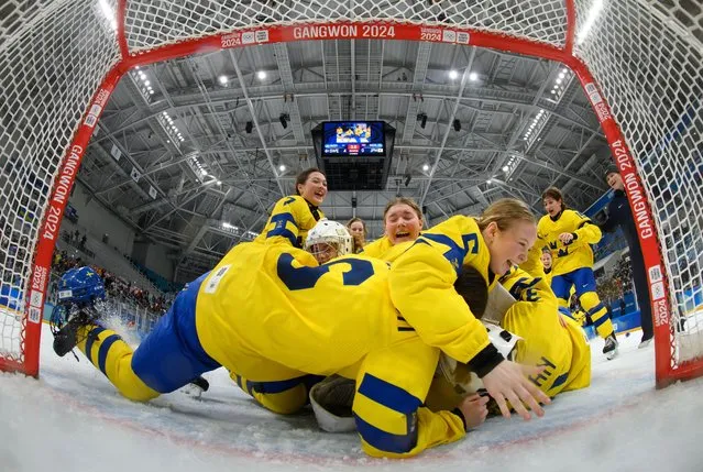 A handout photo made available by the Olympic Information Service (OIS) shows Sweden players celebrate in front of goal after winning the Ice Hockey Women’s 6-on-6 Tournament Gold Medal Game against Japan at the Gangneung Hockey Centre, during the Winter Youth Olympic Games in Gangwon, South Korea, 31 January 2024. (Photo by Joel Marklund/EPA/EFE)