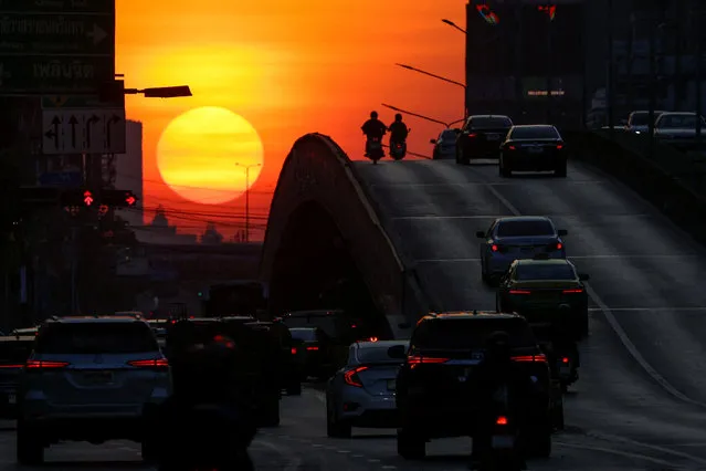 A view of traffic during sunrise in Bangkok, Thailand on January 5, 2024. (Photo by Athit Perawongmetha/Reuters)