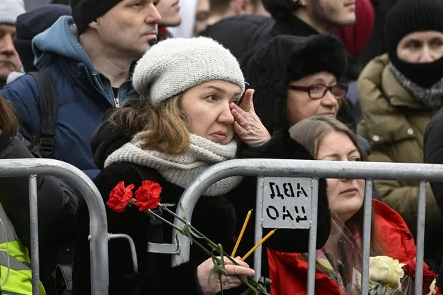 Mourners gather in front of the Mother of God Quench My Sorrows church ahead of a funeral service for late Russian opposition leader Alexei Navalny, in Moscow's district of Maryino on March 1, 2024. (Photo by Alexander Nemenov/AFP Photo)