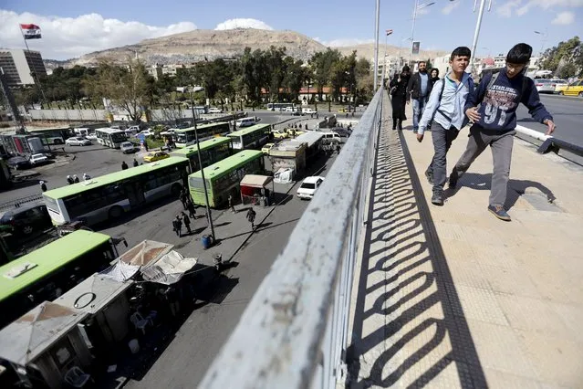 Residents walk on the President bridge in Damascus, Syria March 14, 2016. (Photo by Omar Sanadiki/Reuters)