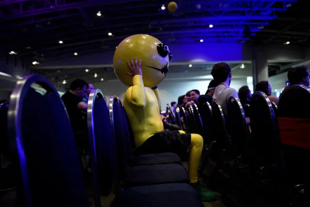 Dallin Young, dressed as Castle Crashers' Alien Hominid, waits to watch a costume contest during Awesome Con, Washington DC's Comic Con, on April 27, 2019, in Washington, DC. (Photo by Brendan Smialowski/AFP Photo)