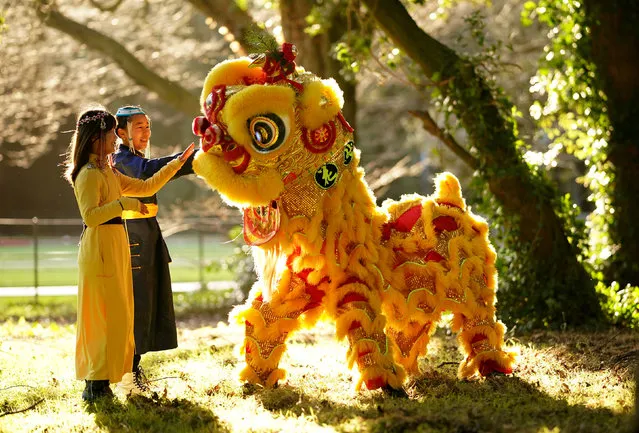 Khuslen Anglin (left) and Engshigelen Sandagsuren, both 11, with a Chinese Lion at Dublin City Farm at St Anne's Park on Monday, January 9, 2023 to mark the launch of the programme for Dublin Lunar New Year which runs from 21-29 January. (Photo by Niall Carson/PA Images via Getty Images)